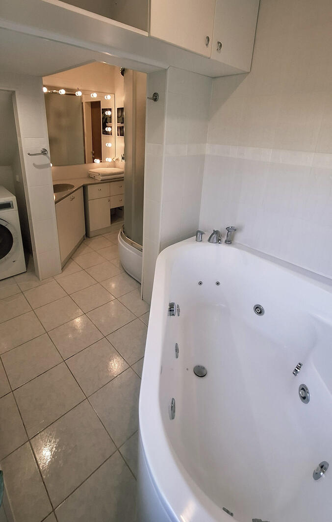 There is all You need - jacuzzi, shower, big mirror with lights and washing machine
