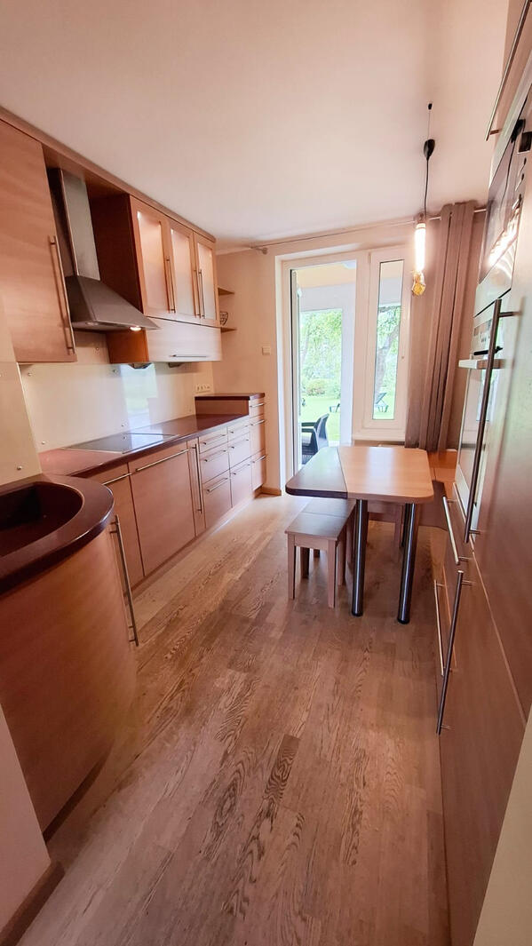 Fully equipped kitchen with entrance to the terrace and garden